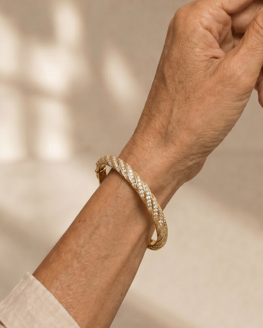 BRAZALETE TRENZADO DORADO