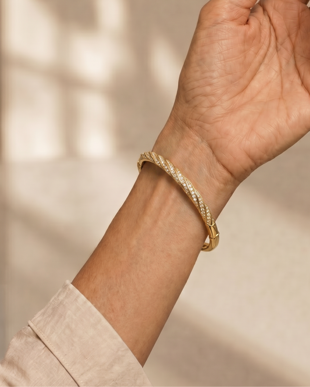 BRAZALETE TRENZADO DORADO