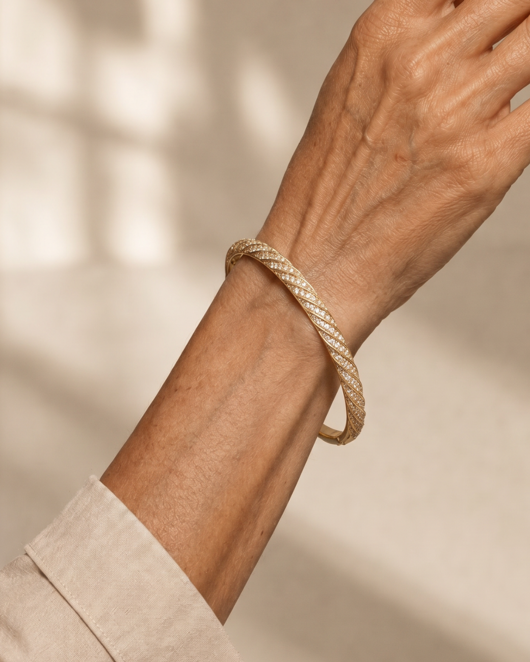 BRAZALETE TRENZADO DORADO