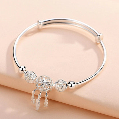 PULSERA PLATA PLUMAS COLGANTES