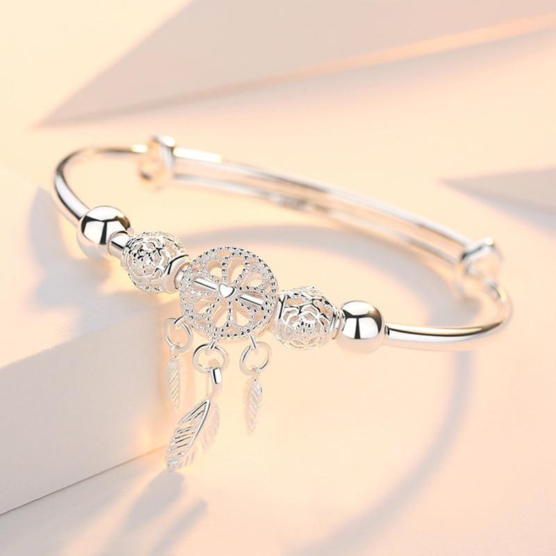 PULSERA PLATA PLUMAS COLGANTES