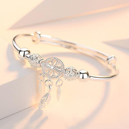 PULSERA PLATA PLUMAS COLGANTES