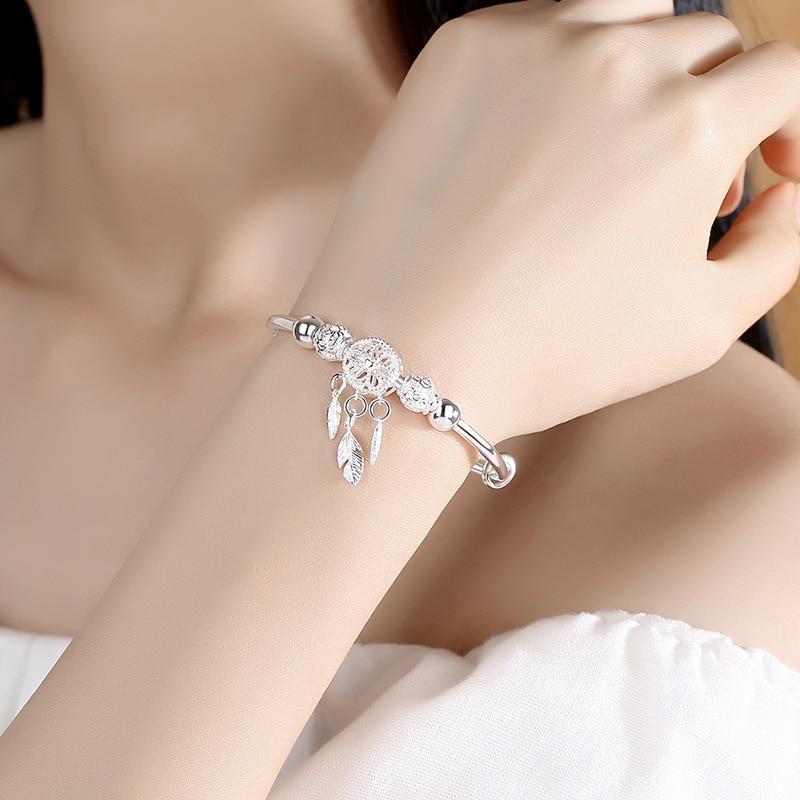 PULSERA PLATA PLUMAS COLGANTES