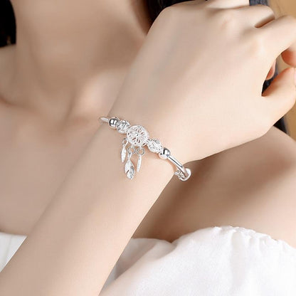 PULSERA PLATA PLUMAS COLGANTES